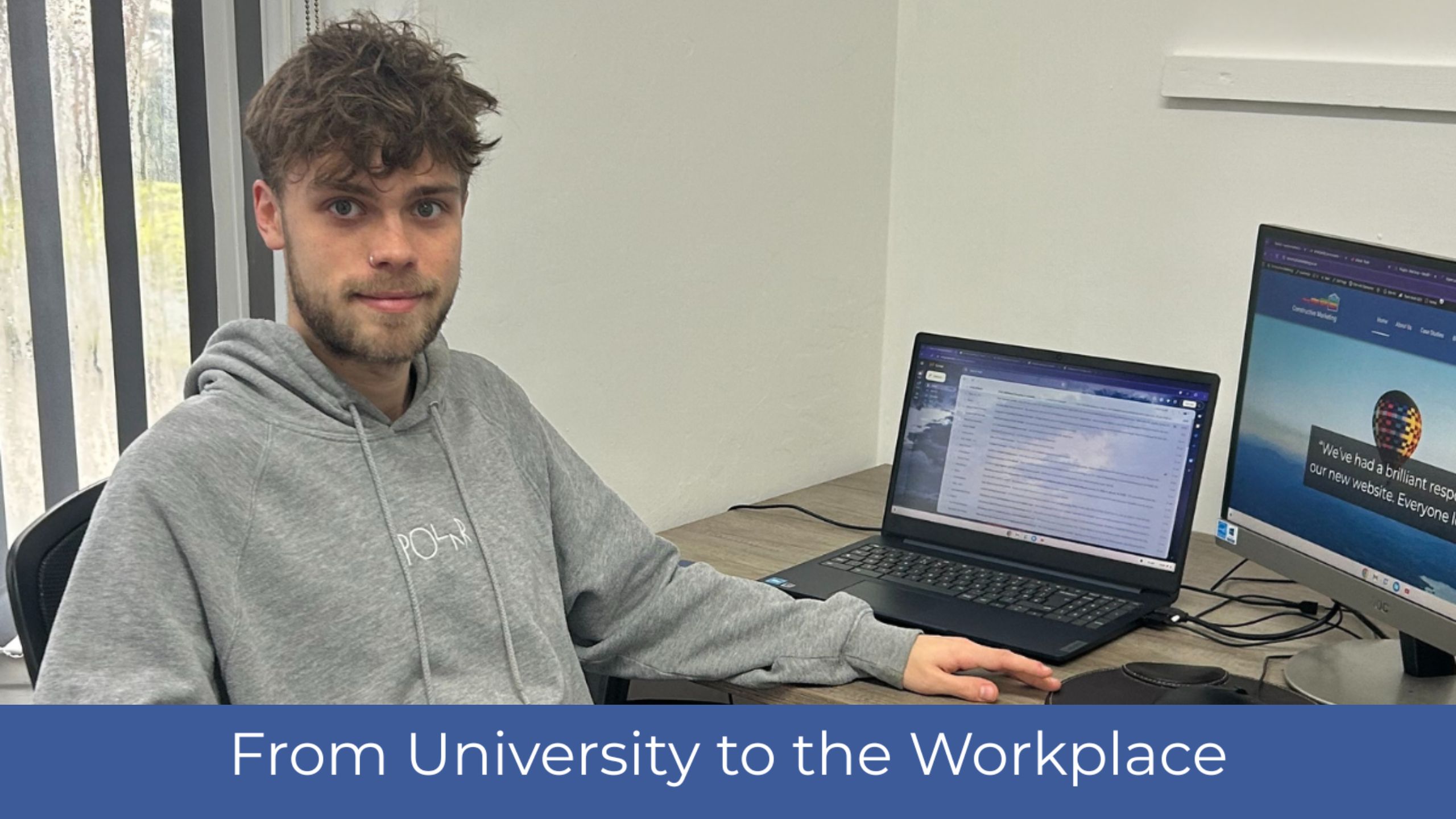 Image shows Matt Rowland From Constructive Marketing sitting at a desk with a laptop and monitor